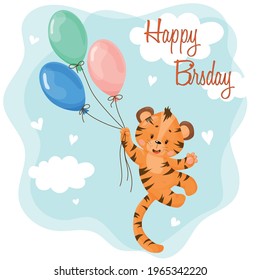 A cute little tiger cub is flying on a bunch of balloons