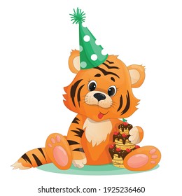 a cute little tiger cub is sitting in a festive hat with a cake in his arms