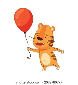 Cute little tiger holding red inflatable balloon. Adorable baby animal character cartoon vector illustration