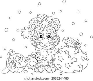 Cute little tiger in a Santa hat sitting on snow with a beautiful gift bag and a Christmas toy ball, black and white outline vector cartoon illustration for a coloring book page