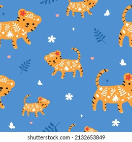 Cute little tigers in seamless vector pattern for kids textile or wrapping paper. Funny tropical illustration with repeating decorative ornament and wild african animals