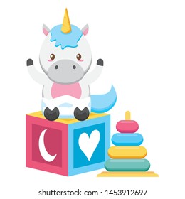 cute little unicorn with rings and block vector illustration design