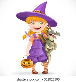 Cute little witch with a dragon under his arm and a pumpkin basket for sweets isolated on white background