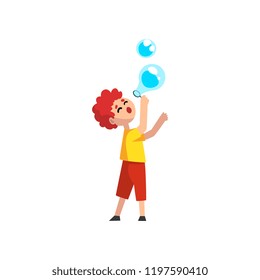 Cute llttle redhead boy blowing soap bubbles cartoon vector Illustration on a white background
