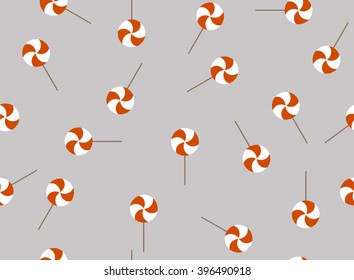 Cute lollipop on grey background. Seamless repeat pattern. Fan for kids dresses textile.