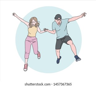 A cute male and female couple is folding their hands and jumping. hand drawn style vector design illustrations. 