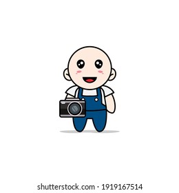Cute mechanic character holding a camera. Mascot design concept