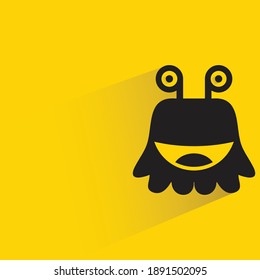 cute monster with shadow on yellow background