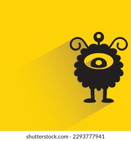 cute monster with shadow on yellow background