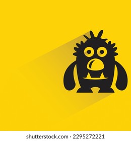 cute monster with shadow on yellow background