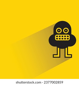 monstruo lindo con sombra en el fondo amarillo