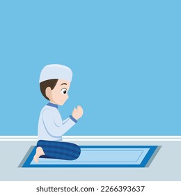 Cute moslem boy praying with hand held high after doing prayer