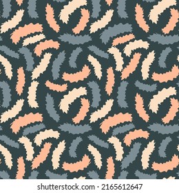 Cute motley spotted seamless pattern. Sand, coral, azure curved abstract shapes with torn edges are randomly located on a dark background. Vector.