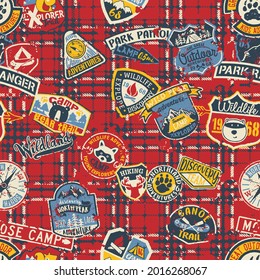 Cute mountain camp and wildlife adventure badges patchwork with grunge tartan plaid background vector seamless pattern 