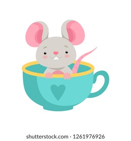 Cute mouse sitting in a ceramic cup, funny animal cartoon character vector Illustration on a white background