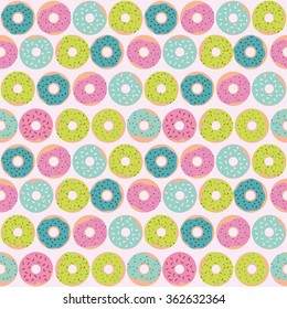 Cute multicolored pattern with sweet donuts. Seamless texture with dessert illustration.