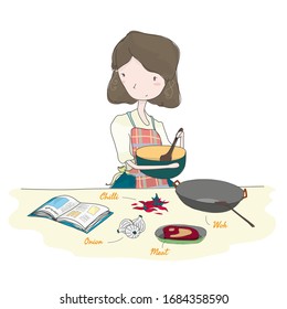 Cute Mum Cooking in Kitchen with Recipe Book