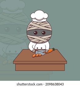 Cute mummy chef cutting carrot