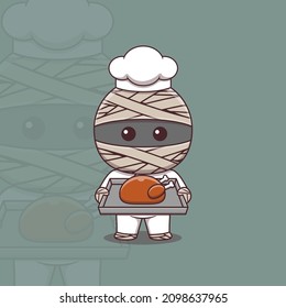 Cute mummy chef holding a tray of roast chicken
