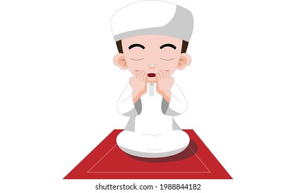Cute Muslim Boy praying on red Carpet 