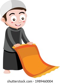 a cute muslim boy taking carpet for solat