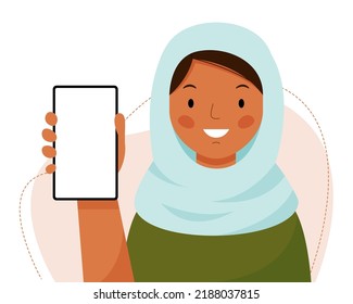 A cute muslim girl in a headscarf holds a phone in her hands. The islamic woman shows an empty phone and smiling. Vector flat illustration