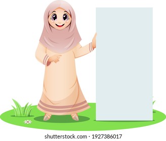 Cute Muslim girl standing with blank sign