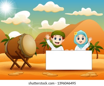 Cute muslim kid holding blank sign in the desert landscape