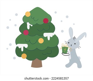 A cute New Year's rabbit decorates the Christmas tree on a white isolated background. The bunny carries a gift under the Christmas tree. Chinese character for 2023. Vector cartoon. Cartoon flat style.