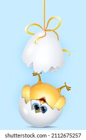 Cute newborn little yellow chick fallen upside down from broken eggshell. Easter and birthday concept