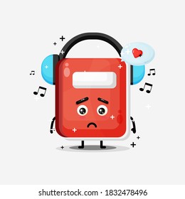 Cute notebook mascot listening to music