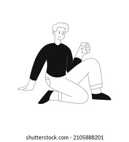 Cute office employee concept. Young man in black sweater sitting on his knee and holding cup of hot coffee. Male character on break. Cartoon flat vector illustration isolated on white background