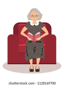 Cute old lady is sitting in a red armchair and reading a book. Vector illustration