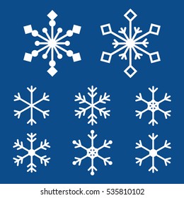 Cute outlined white snowflakes for winter and christmas design on dark blue background.
