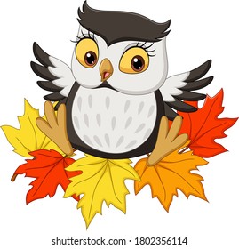 Cute owl cartoon sitting on autumn leaves