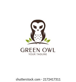 Cute owl standing on tree branch logo