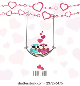 Cute owls couple in love, swinging by a hearts decorated rope with I Love You text for Happy Valentine's Day celebration.