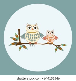 
cute owls couple sitting on a branch