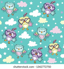 Cute owls on a blue background seamless pattern