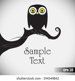 cute owls on the tree branch
