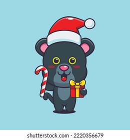 Cute panther holding christmas candy and gift. Cute christmas cartoon illustration. 