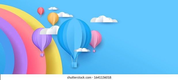 Cute Papercut Sky Landscape Background With Copy Space. Hot Air Balloon, Rainbow And Clouds Made In Realistic Paper Craft Art Or Origami Style For Baby Nursery, Children Design. 