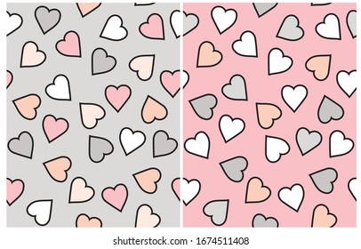 Cute Pastel Color Hearts Seamless Vector Pattern. Romantic Print. Hand Drawn Hearts Isolated on a Pink and Light Gray Background. Repeatable Print with Confetti of Heart Shape with Black Outline.