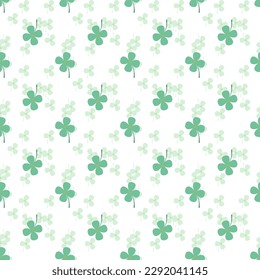 Cute pastel green clovers are surrounded by small green tone clovers background, a seamless pattern that looks beautiful, bright and attractive.