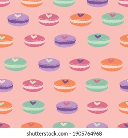 Cute pastel macarons with hearts seamless vector pattern. Valentines day surface print design for fabrics, stationery, scrapbook paper, gift wrap, textiles, backgrounds, and packaging.