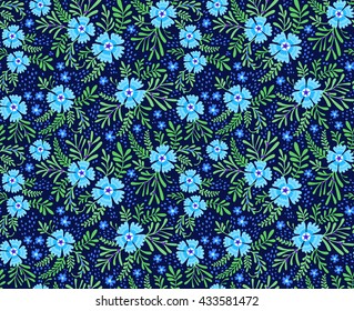 Cute pattern in small flower. Small blue flowers. Dark blue background. Ditsy floral background. The elegant the template for fashion prints.