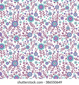 Cute pattern in small flower. Small colorful  flowers. Blue background. Floral seamless pattern. 