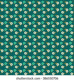 Cute pattern in small flower. Small colorful  flowers. Blue background. Floral seamless pattern. 