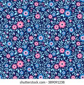 Cute pattern in small flower. Small colorful flowers. Blue background. Floral seamless pattern. Small cute simple spring flowers. Design concept for fashion textile print.
