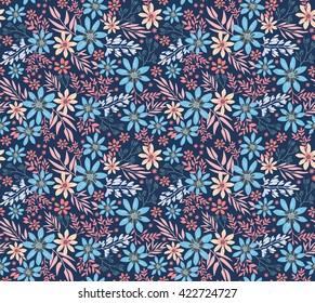 Cute pattern in small flower. Small colorful flowers. Dark blue background. Spring floral background. The elegant the template for fashion prints.
